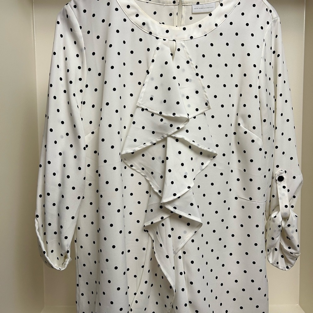 Women’s long sleeve, ruffle front polka dot top
